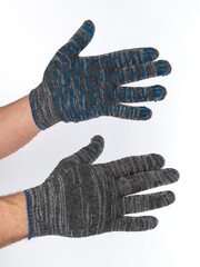 gloves made of cotton with enhanced impregnation with the fingers of male hands on a white background.