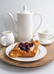 Sweet cherry and cream, puff pastry dessert , diamond shaped.