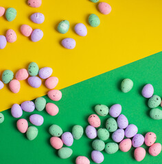 Easter background made of Pastel eggs. Overhead view, close up