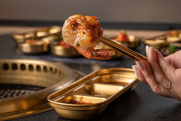 Korean Barbecue cooking Shrimp at the table