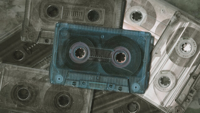 Vintage audio cassette tapes placed next to each other. Obsolete technology of audio recording and playback format audio cassette tapes,top view. 80s retro music background.  