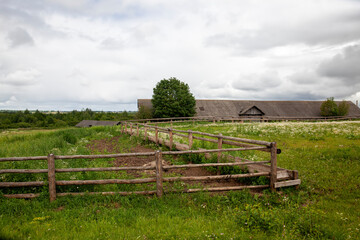 part of a wooden fence for livestock in the village