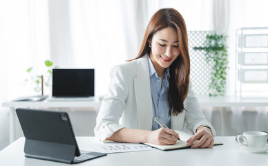 girl working at office on desk with computer graph work concept. beautiful smile