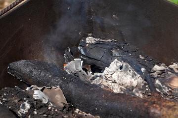 orange flame of fire while burning branches and firewood
