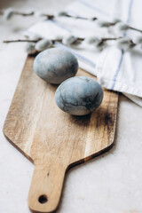 Fototapeta na wymiar festively decorated Easter eggs painted with natural blue headlights by soaking in tea hyacinth tea