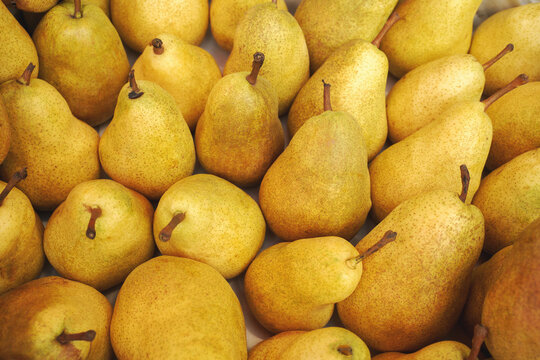 fresh ripe pears as background, top view.
