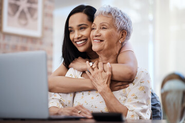 Its those little moments in life. Shot of a senior woman using a laptop with her daughter at home. - obrazy, fototapety, plakaty