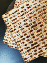 Matzah on a plate on a dark background