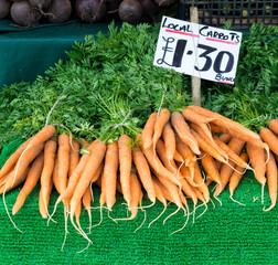 CAMBRIDGE, UK - AUGUST 11, 2017:  Local Grown Carrots For sale on Market Stall