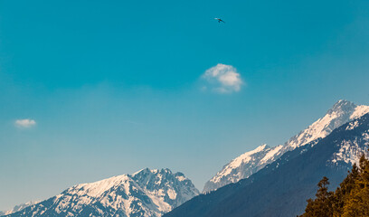 Beautiful alpine winter view with a hang-glider near Telfs, Tyrol, Austria
