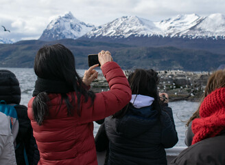 People taking pictures in the mountains.