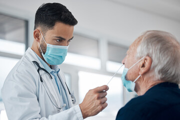 Positive people arent eligible for the vaccine. Cropped shot of a handsome young male doctor testing a senior patient for covid.