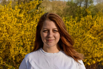 Portret of woman in white shirt on yellow background © Victoria