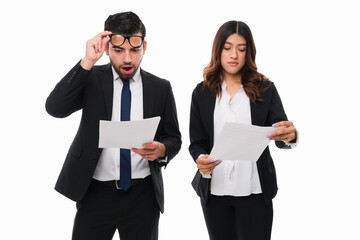 Shocked business partners working