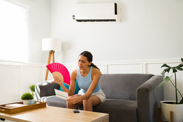 Woman doesn't want to turn the air conditioning