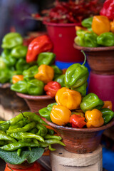 A Bowl of Habanero Chilis in a Market