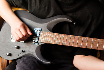 Close-up of a hand playing the guitar. Guitarist on stage for background, soft and blur concept....