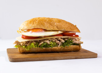 Homemade Hoagie with meat chicken egg, lettuce and Tomato. Official Sandwich of Philadelphia. National Hoagie Day concept