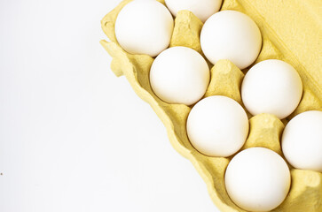 eggs in a tray on a white background