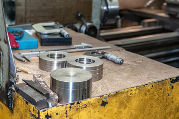 metal workpieces after turning and milling on the rack . Metal shavings on a lathe. metalworking...