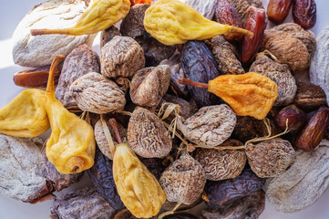 Top view of delicious dried figs, pears and dates, panoramic shot. dried fig background