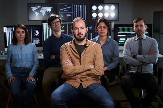 Serious Faces Confident Diverse Business People Office Workers Team In Row Looking At Camera. Caucasian Professional Employees Executives Group Posing Together For Corporate Portrait, Leadership