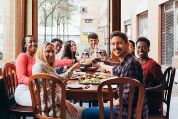 group of friends celebrating a meal in a restaurant