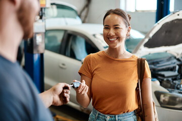 We take care of cars and the people who drive them. Shot of a woman receiving her car keys. - Powered by Adobe