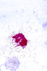 stain from red wine spilled on a white cloth