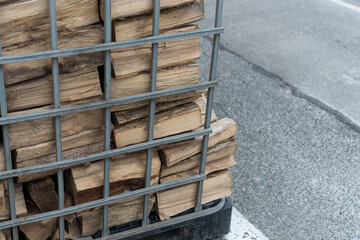 firewood in a metal crate
