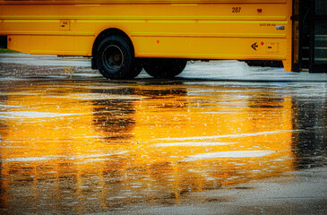 A heavy spring rain comes down in buckets in Windsor in Upstate NY.  Reflection of the yellow...