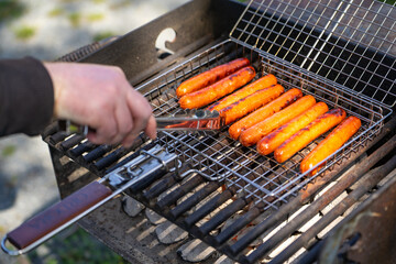 Sausages are cooked on the grill.
bbq party.