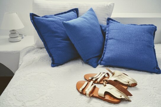 Blue pillows and mercury sandals in Greece