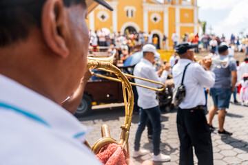 Unrecognizable musician in a religious procession during Holy Week in Masatepe, Masaya, Nicaragua.