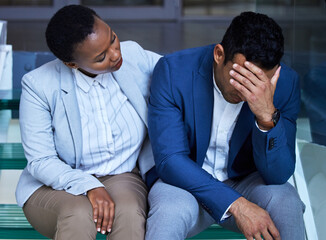 On the other side of a storm is the strength. Shot of a young woman comforting her colleague at work.