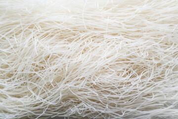 raw dry bihun or vermicelli or  rice noodles or angel hair isolated on white background
