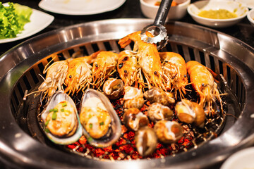 Shrimp and Mussel shell Seafood on charcoal grill.