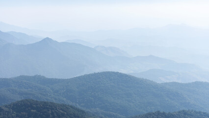Mountain range layer with faded fog.