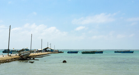 Samll harbor with fishing boats and ferries in Sri Lanka