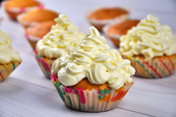 Homemade cupcake with buttercream. Delicious cupcakes on table close up.