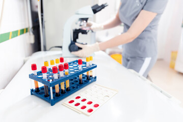 Lab worker preparing test blood for detection of antibodies and infections Corona virus