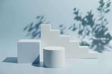 Abstract minimalistic scene with geometric forms. podium on blue background with shadows. product...