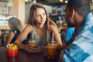 Theyve got loads to catch up on. Cropped shot of a young couple on a date in a cafe.