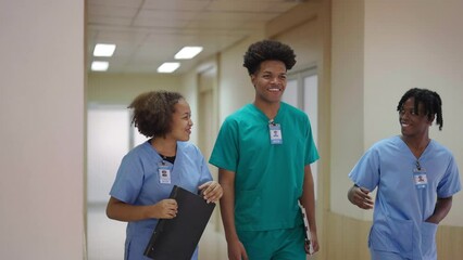 Black group people medical team. Hospital medical staff. Doctor and nurse discuss and walking in hospital