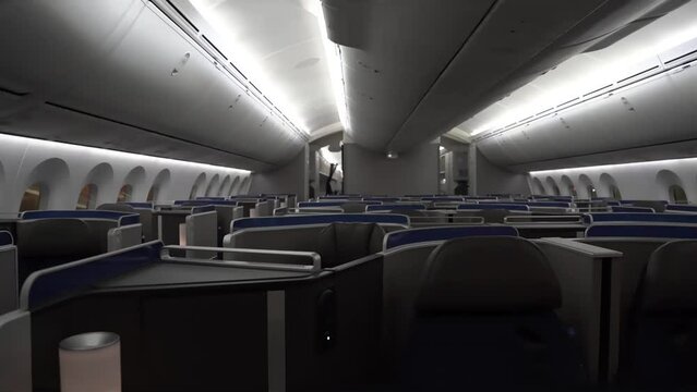 Dolly across the first class seats of a commercial airliner 787 aircraft.