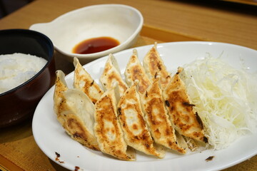 Gyoza or dumplings snack with soy sauce and rice - 餃子 醤油 ご飯
