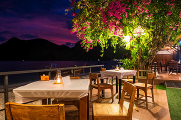 Dinner table by coastline at Phi Phi Don island, Krabi
