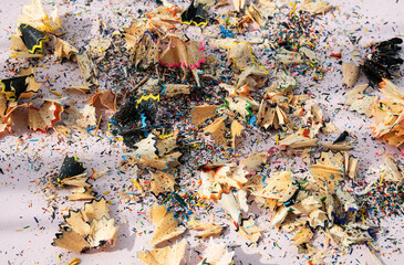 Сolored pencil shavings, close up. Abstract background.