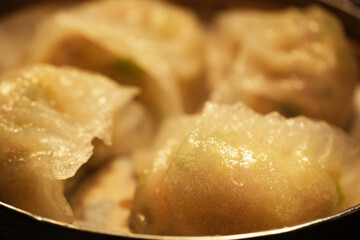 close up steamed crystal dumplings in steamer. Traditional Chinese dim sum snack