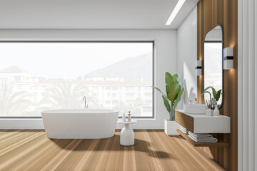 Fototapeta na wymiar Light bathroom interior with tub, deck with decoration and window